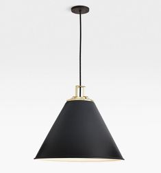 a black and gold pendant light hanging from the ceiling