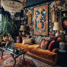 a living room filled with furniture and a chandelier hanging from it's ceiling