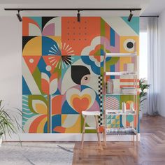 a colorful wall mural with abstract shapes and lines on it's side, in an office space