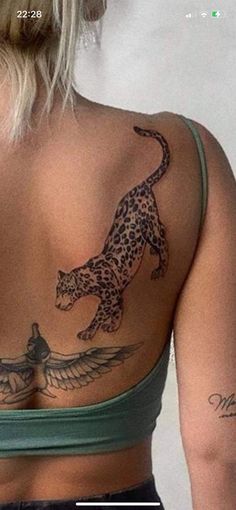 the back of a woman's bra with a cheetah tattoo on it