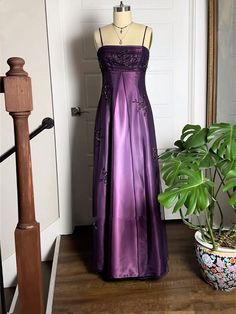 Product Style: #D3RF Material: Satin Color: Purple Built in Bra: Yes Hemline: Floor Length Back Detail: Lace-up Delivery times: Processing time:    2-3 weeks( Prom Season needs more time) Shipping time:      3-5 working days Rush order service is available, if you need rush order, please visit: Rush Order ，rush order fee is $20. Custom Size: For custom size, please give us the correct measurements in the order notes when you check out, and please have a look our measuring guide at first. There is no extra payment for custom size or custom color: Custom Measurements Bust: ________inch/cm, Waist: ________inch/cm, Hips: ________inch/cm Hollow to knee( for knee length dress only):________inch/cm Hollow to Floor(without shoes): ________inch/cm Your Height without shoes______,  The Shoes height Black Tulle Prom Dress, Purple Silhouette, Party Dress Purple, Purple Floor, Tulle Straps, Long Party Dress, Floral Dress Formal, Prom Season, Floor Length Prom Dresses