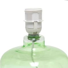 a green glass bottle with a white cap