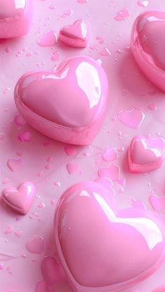 pink hearts floating on top of water with bubbles