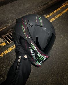 a person wearing a motorcycle helmet on the street