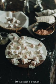 some food is sitting on a plate near other dishes