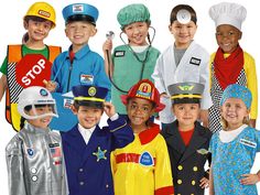 a group of children in costumes standing next to each other on a white background with one child wearing a fireman's hat