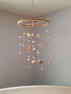 a baby crib with a star mobile hanging from the ceiling