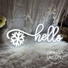 a white fur rug with the word hello written in cursive writing on it