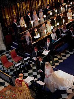 the bride and groom are getting ready to walk down the aisle at their wedding ceremony