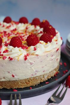 a cake with raspberries on top and the words happy woman's day