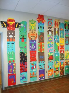 an office hallway decorated with brightly colored skis on the wall and tiled flooring