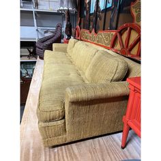 a couch sitting on top of a wooden table