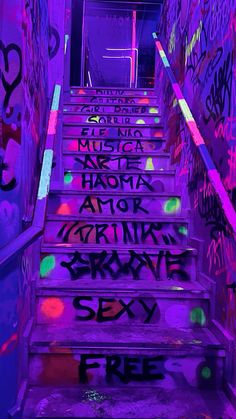 the stairs are covered in graffiti and have been painted with neon colors to give it an interesting effect