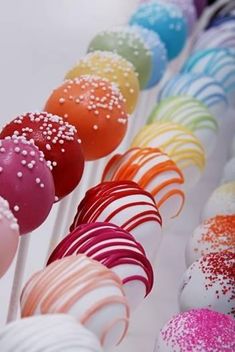 colorful cake pops with sprinkles on them