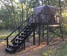 a set of stairs leading up to a tree house