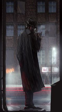 a man standing in the rain talking on his cell phone