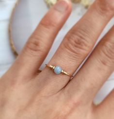 ✨ Blue Angelite Wire Ring, 14K Gold Filled, Rose Gold Filled, Sterling Silver, Tiny Gemstone Ring, Pinky RingSizing:• Gemstone Size: 4 mm• Ring Band: 0.8 mm • Handmade in your ring size with a natural gemstone bead. • Dainty & cute. The ring is slim and petite, yet durable to wear daily. • Gold-filled wire is known for its lasting quality. The ring will not tarnish or turn color. You can wear them every day or even in a shower.• Hypoallergenic. You won’t have to worry about allergies from metal Diy Wire Rings, Gold Wire Ring, Diy Wire Jewelry Rings, Diy Earrings Easy, Wire Jewelry Rings, Fancy Earrings, Wire Ring, Sterling Silver Wire Wrap, Diy Wire Jewelry