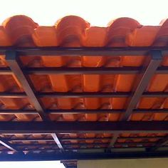 an orange tiled roof on top of a building