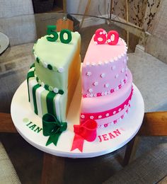 two birthday cakes sitting on top of a table