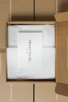 an open box with some white napkins in it and instructions on how to fold them