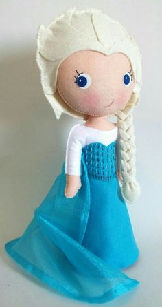 the doll is wearing a blue dress