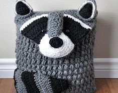 a crocheted bag with a raccoon on it