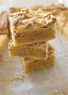 three pieces of peanut butter bars stacked on top of each other