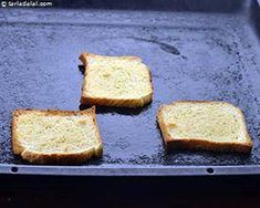 four pieces of toast sitting on top of a pan