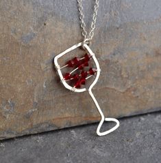 I'll have a glass of your finest red! Maybe you love the less-serious side of jewelry. Maybe you just love wine! I know I do. This hand-hammered necklace is sure to bring smiles and conversation wherever you go. Tiny Swarovski crystal beads strung on sterling silver wire stand in for your favorite red. The pendant is approximately 0.5 inches wide and approximately 1.25 inches long. Choose your chain length, or leave a note to seller if you would like a chain length other than those listed. All i Sterling Silver Birthstone Necklaces For Parties, Nickel Free Sterling Silver Party Necklace, Sterling Silver Necklace For Valentine's Day Party, Wire Wrapped Jewelry For Valentine's Day Anniversary, Valentine's Day Wire Wrapped Jewelry For Anniversary, Personalized Sterling Silver Necklaces For Party, Silver Necklaces For Mother's Day Party, Valentine's Day Silver Jewelry Gift Wrapped, Mother's Day Party Sterling Silver Necklace