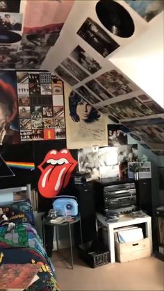 the rolling stones bedroom is decorated with pictures and posters