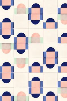 an abstract tile pattern with blue, pink and green circles