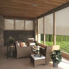 a living room filled with furniture next to a window covered in blinds and windows coverings