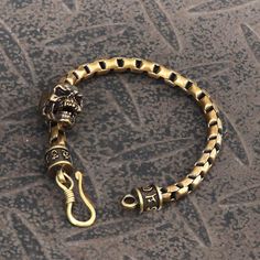 This bracelet is made of brass with a grisly skull in the middle. With its... Rocker Outfits, Chain Pants, Rocker Outfit, Brass Box, Ear Chain, Biker Gear, Animal Pendant, Vintage Skull, Skull Bracelet