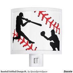 a night light with a baseball player and bat silhouettes on the wall next to it