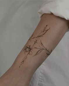 a person with a flower tattoo on their arm