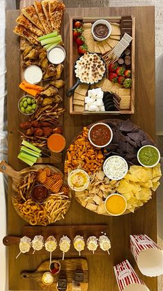 a wooden table topped with lots of food