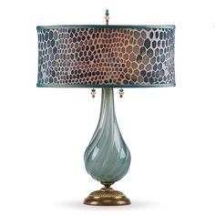 a table lamp with a blue shade on it's base and a leopard print lampshade