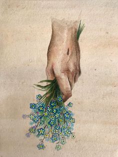 a painting of a hand holding blue flowers