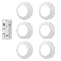 six white round lights with remote control on the side and four different color buttons for each light