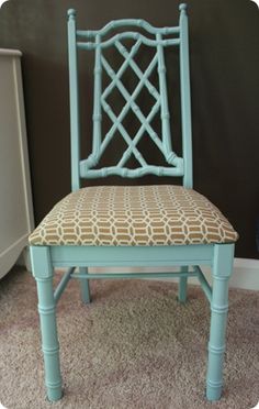 a blue chair with a patterned seat cushion