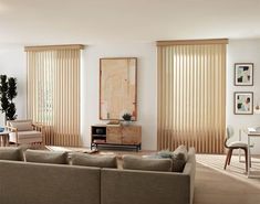 a living room filled with furniture and windows covered in blinds