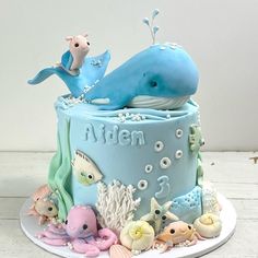 a blue cake with an ocean theme on it