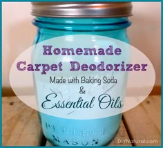 a blue mason jar with the words homemade carpet deodorizer made with baking soda and essential oils