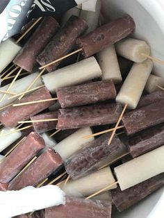 marshmallows and sticks in a white bowl