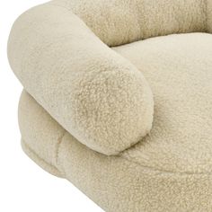 the pillow is shaped like an animal's head and has been made out of sheep fur