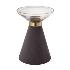 a glass and metal vase sitting on top of a white surface with a gold rim