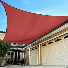 a red shade is hanging over a garage