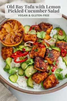 a white bowl filled with chicken and cucumber salad