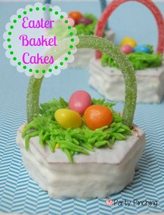 two small baskets filled with easter eggs on top of a table