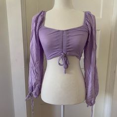 Purple Princess - Y Crop Top! This Piece Has So Much Potential And Versatility! Would Look Great Casually With Jeans, Or A Corset For A More Princess-Y Or Cottagecore Vibe, Could Also Layer Well With A Fairycore Look - And So Much More! Options Galore! Has Minor Signs Of Wear! No Flaws, But Doesn’t Look Brand New Either. #Coquette #Fairy #Fairycore #Princesscore #Cottagecore Rapunzel Disney Tangled Ruched Blouse Corset On Top Of Shirt, Purple Corset Top, Princesscore Cottagecore, Rapunzel Disney, Ruched Blouse, Purple Princess, Purple Tops, Purple Crop Top, Coquette Fairy